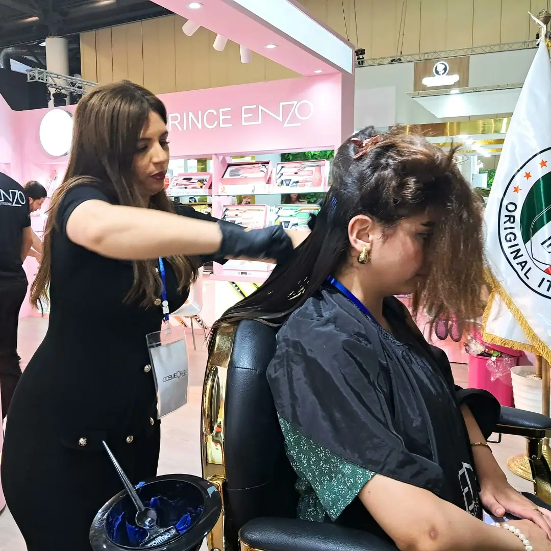 A hair colour applied live at the stand of a hair care brand