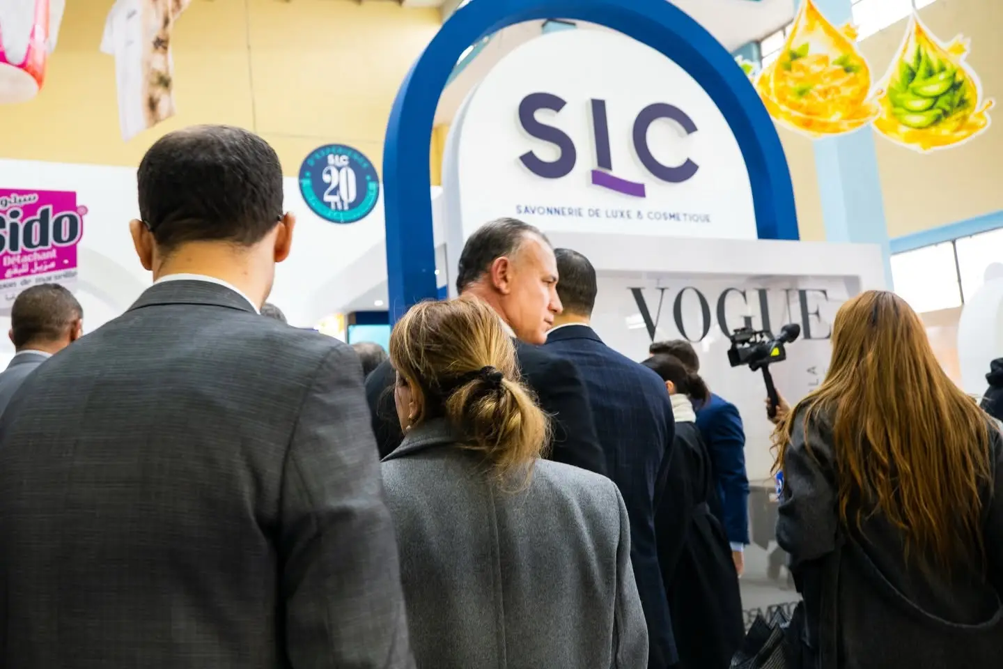 Visitors in front of a stand at Cosmetica Africa 2026, at the Palais des Expositions in Algiers