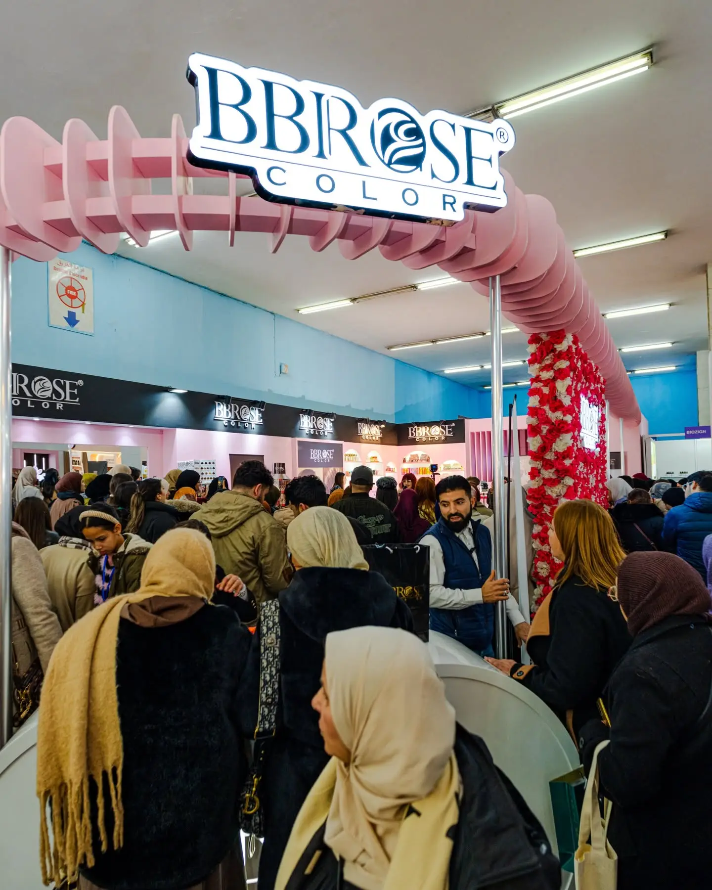 The crowd in front of the arch of a brand's stand