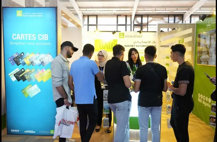 Visitors at a bank's stand during the first ECSEL Expo, in Algiers in 2022