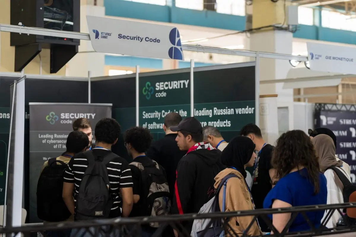 Young visitors gathered at a cybersecurity vendor’s stand